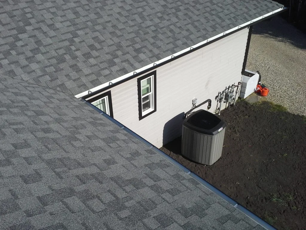 Air conditioner installed at the side of a house